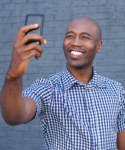 A young man taking a selfie 